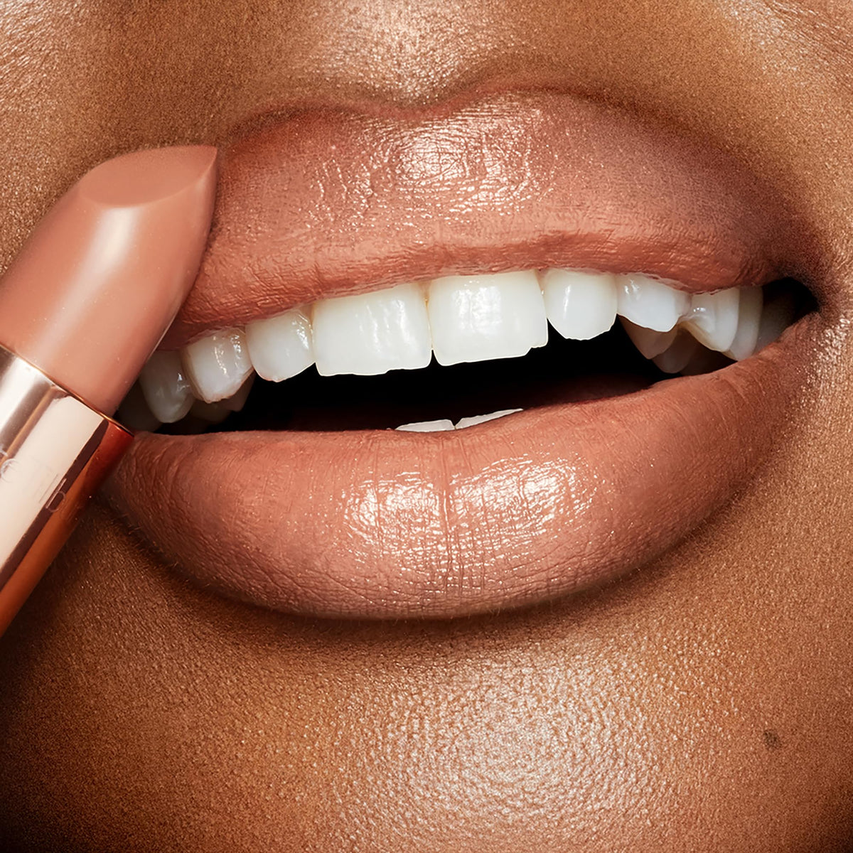Charlotte Tilbury swatch of Nude Kate on skin highlighting true pink-nude shade benefit