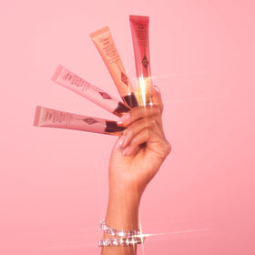 Charlotte Tilbury in a beauty bag on a vanity suggesting portable, on-the-go makeup convenience
