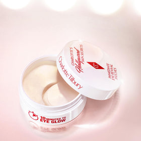 Charlotte Tilbury patches in a makeup setting, primes under eyes for flawless makeup