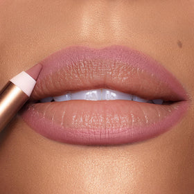 Charlotte Tilbury application in hand illustrating easy glide and comfortable wear