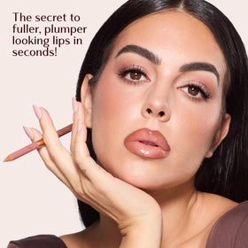 Charlotte Tilbury pencil in hand for scale and easy on-the-go application benefit