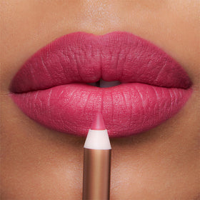 Charlotte Tilbury lip-on model showing shaped, fuller-looking pout for statement wear