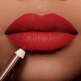 Charlotte Tilbury lip liner applied on lips in studio, demonstrating fuller-looking pout