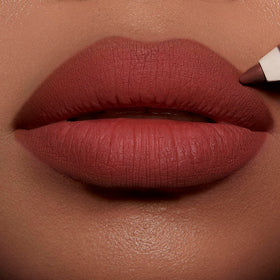 Charlotte Tilbury open cap and label visible to show shade name and product construction benefit