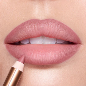 Charlotte Tilbury multiple swatches on arm revealing Pillow Talk Fair shade and buildable coverage