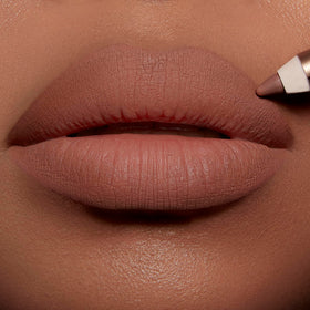 Charlotte Tilbury lip liner applied on model demonstrating reshaped fuller-looking lips
