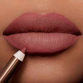 Charlotte Tilbury lips before and after showing reshaped fuller-looking pout and natural finish