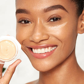 Charlotte Tilbury product on bathroom shelf staged for morning skincare routine