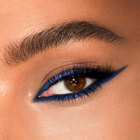 Charlotte Tilbury swatches showing Super Blue matte and metallic texture payoff