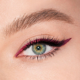 Charlotte Tilbury Magic Eyeliner swatches of maroon matte and metallic shades showing blendability benefit