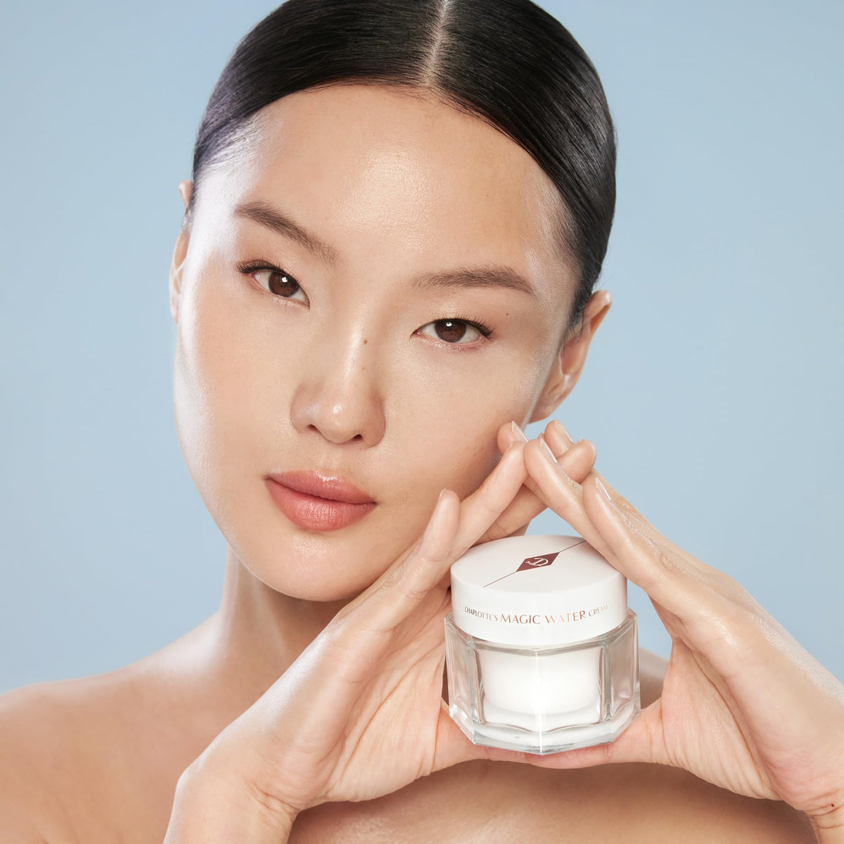 Charlotte Tilbury jar on bathroom shelf lifestyle shot conveying daily routine ease
