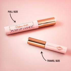 Charlotte Tilbury mascara in hand for scale showing compact travel-friendly size