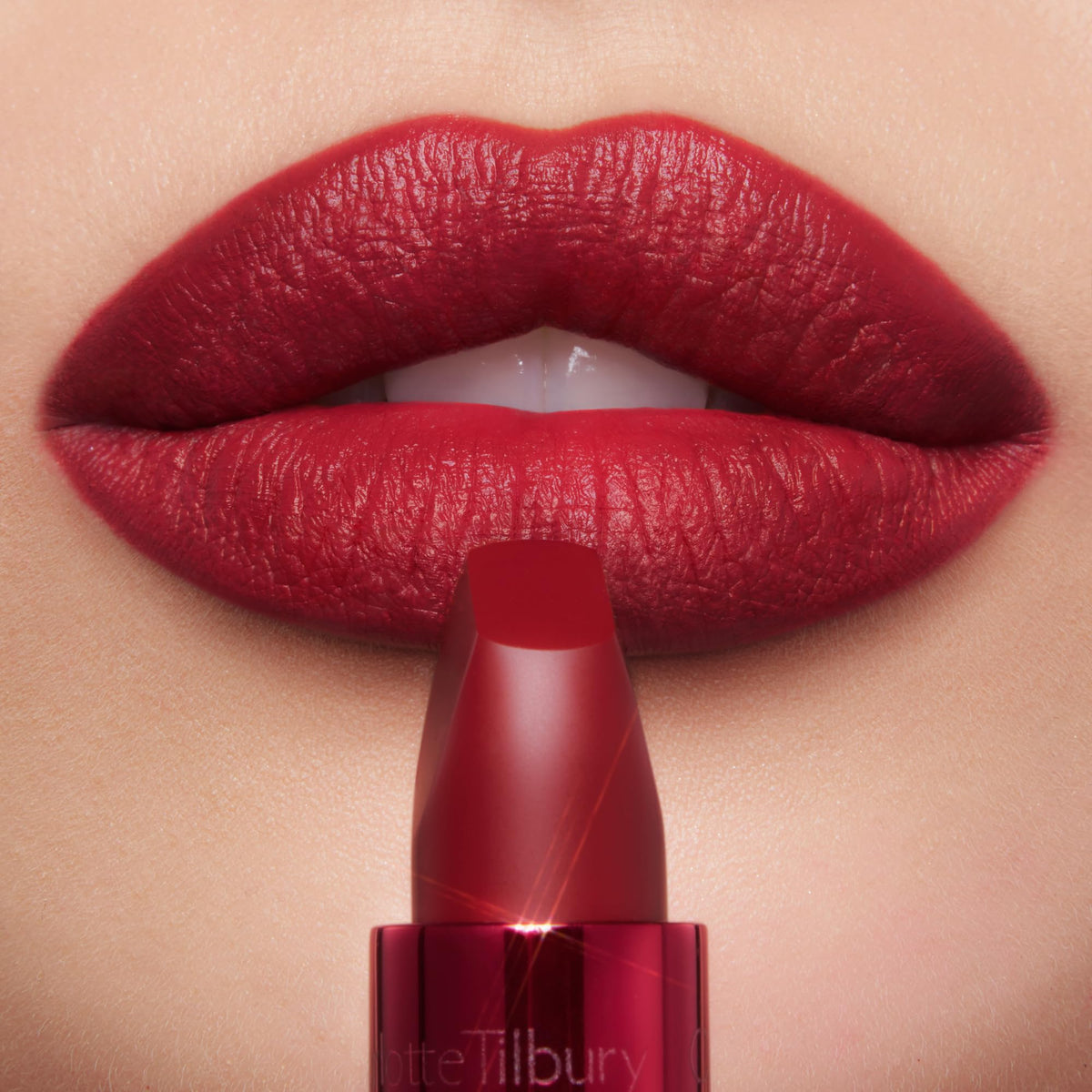 Charlotte Tilbury lipstick applying to lips demonstrating smooth glide and accurate line