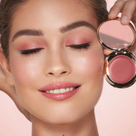 Charlotte Tilbury product on lips in use delivering hydrating tint