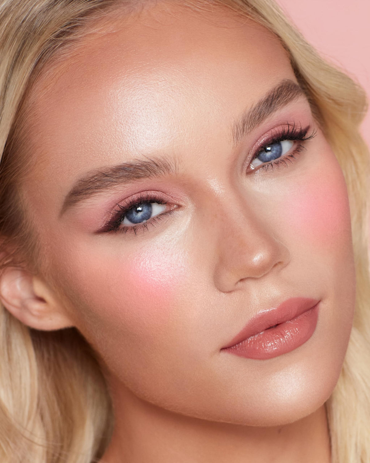 Charlotte Tilbury model wearing Pink Pop on cheeks showcasing lifted flush