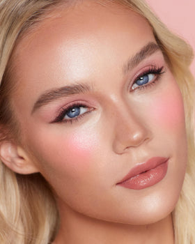 Charlotte Tilbury model wearing Pink Pop on cheeks showcasing lifted flush