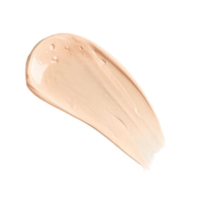 Charlotte Tilbury primer in a makeup bag flatlay ready for travel and touch-ups