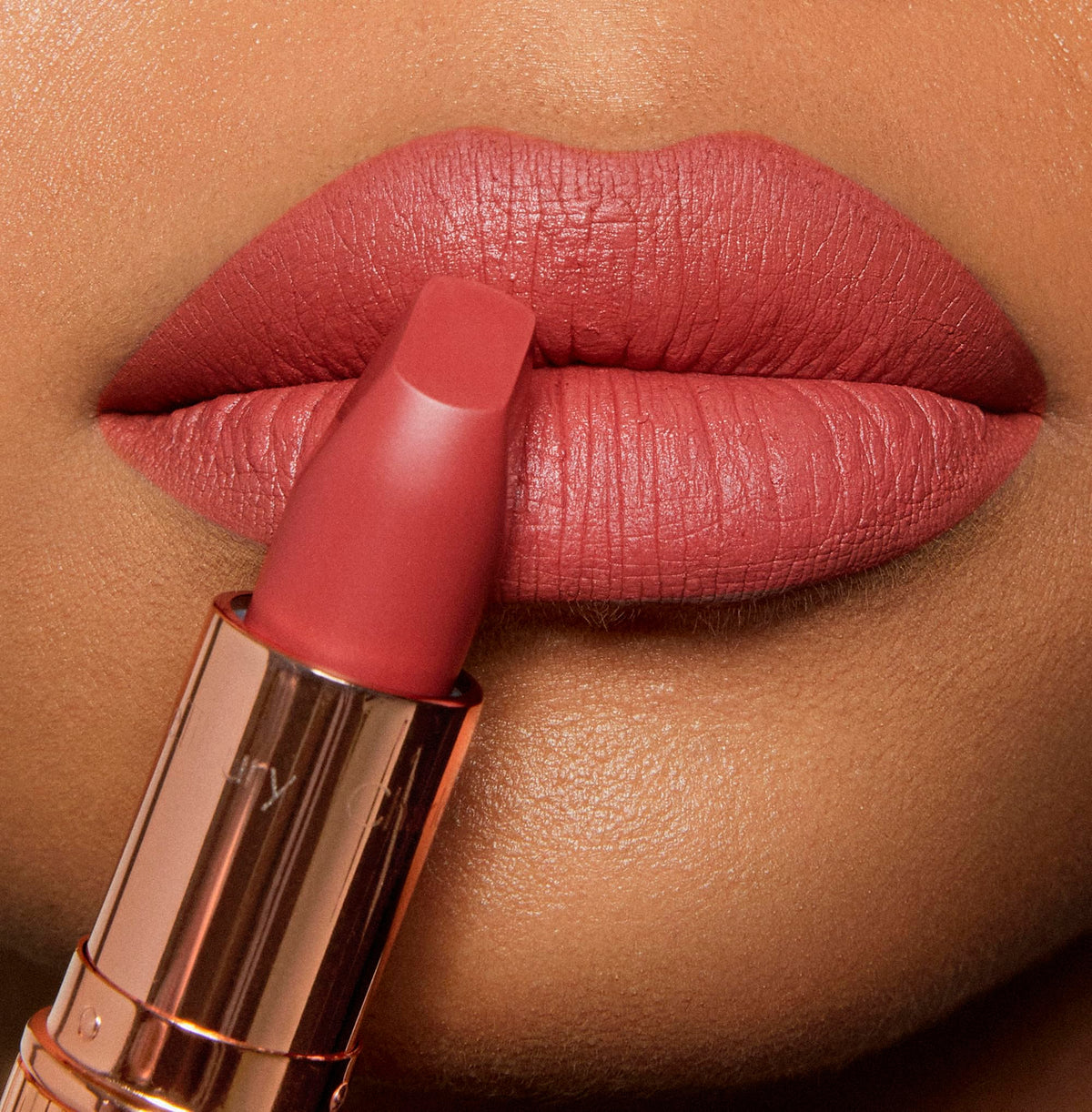 Charlotte Tilbury Sexy Sienna lip application closeup demonstrating smooth, defined edge