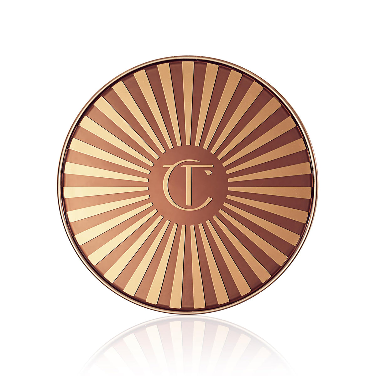 Charlotte Tilbury jar beside hand for scale, clarifies product size and portability