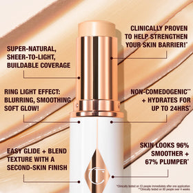 Charlotte Tilbury swatch of 1.5 Fair blended on fair skin showing sheer glowy coverage