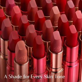 Charlotte Tilbury swatches on arm comparing color depth for layering choices