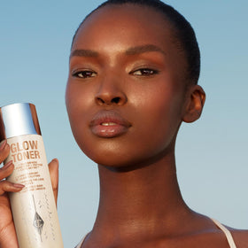 Charlotte Tilbury droplet of toner on skin illustrating lightweight absorption