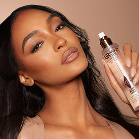 Charlotte Tilbury bottle in travel pouch showing convenience for on-the-go benefit