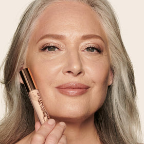 Charlotte Tilbury under-eye before and after showing brightening effect and lifted appearance benefit
