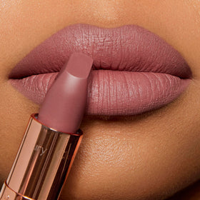 Charlotte Tilbury packaging flatlay with lipstick and box showcasing gift-ready presentation