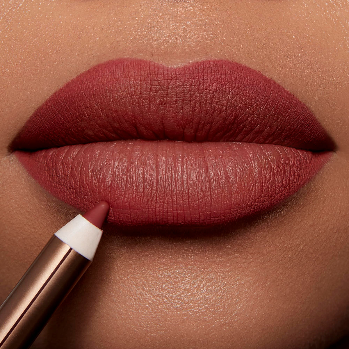 Charlotte Tilbury lip liner in use on model for precise definition benefit