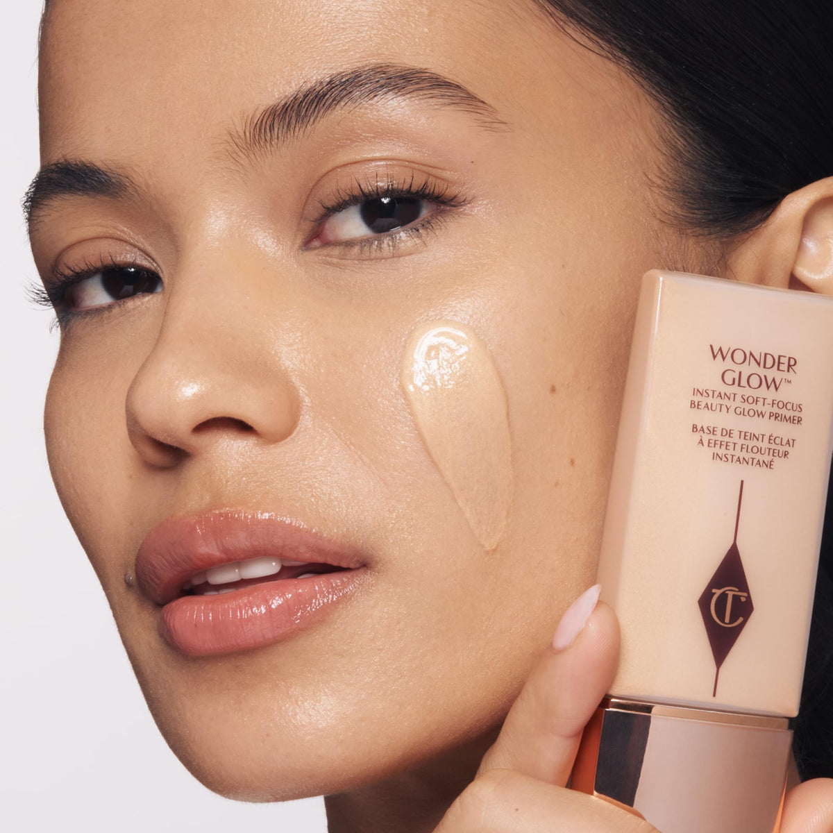 Charlotte Tilbury hyaluronic acid and rosehip oil ingredients visual highlighting hydration benefits
