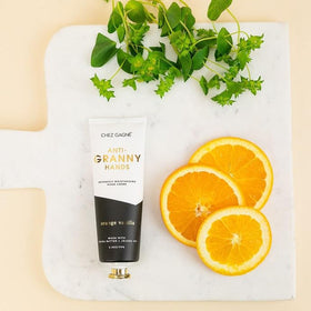 Applying Chez Gagné hand cream in palm demonstrates fast absorption for busy days