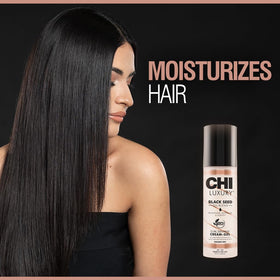 CHI styling in use scrunching damp hair to define natural curls