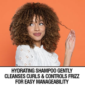CHI CurlyCare in-hand usage showing application on wet curls for easier detangling