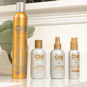 CHI product in use during blowdry to reduce frizz and add shine