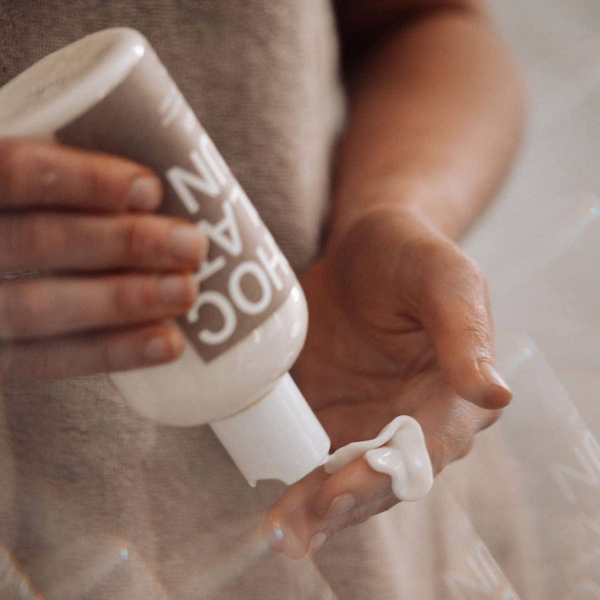 Chocolate Sun being applied with a mitt for even, streak-free results and glow