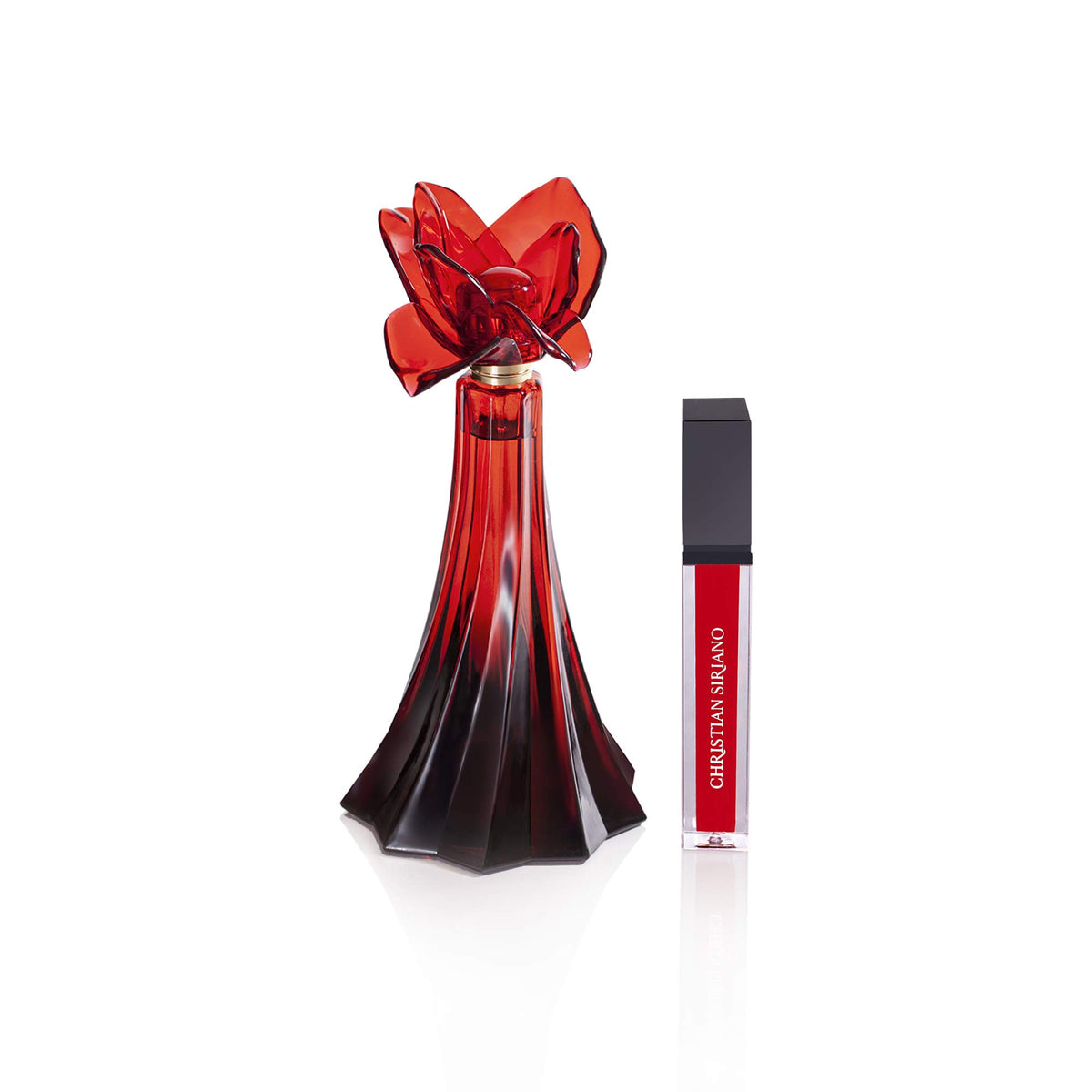 Christian Siriano lip gloss in use adding shine and complementing scent