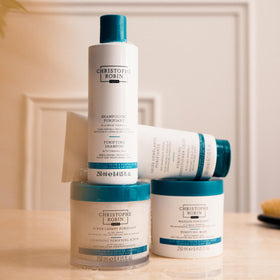 Christophe Robin jar on bathroom shelf suggesting weekly spa-like routine