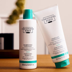 Christophe Robin before and after hair strands, displays improved strength and shine