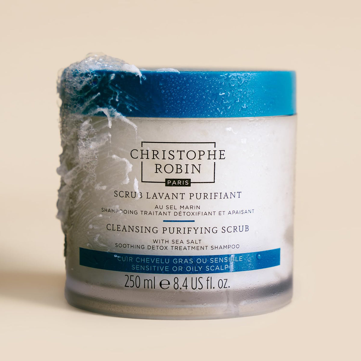 Christophe Robin product scooped in hand demonstrating compact creamy texture
