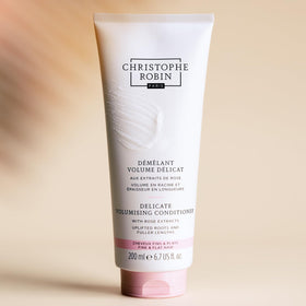 Christophe Robin on a bathroom shelf in lifestyle scene conveying premium routine benefit