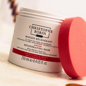 Christophe Robin mask size comparison beside household item showing 8.4 fl oz scale
