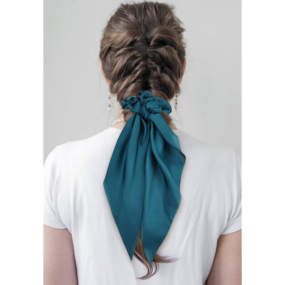 Cinaci scrunchie holding a ponytail, demonstrating secure hold and shine