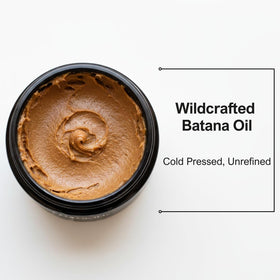 CinNoir Batana oil being massaged into scalp for deep nourishment