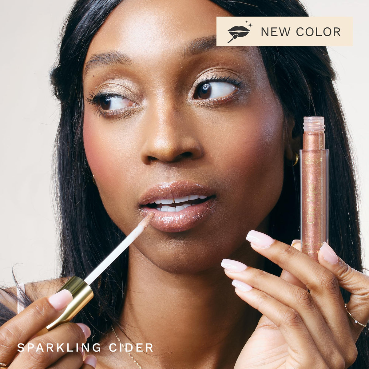 City Beauty gloss on model lips demonstrating fuller-looking, glossy finish