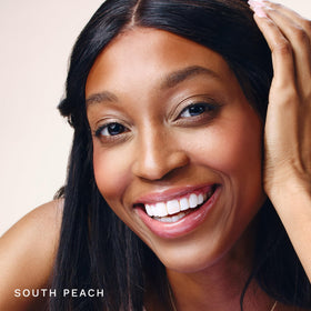 City Beauty City Lips shade on lips demonstrating South Peach color and instant visual plump