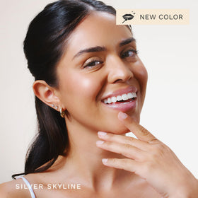 City Beauty gloss in hand lifestyle shot conveying everyday use and comfort