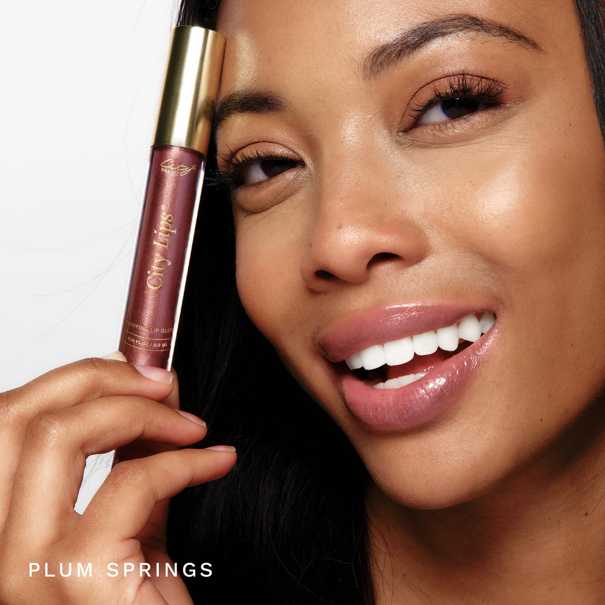 City Beauty City Lips texture swipe revealing glossy finish and hydrating sheen