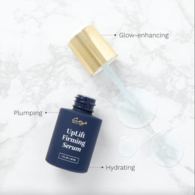 City Beauty applying serum to face for instant lifting effect
