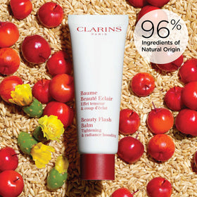 Clarins jar held in hand showing size and travel-friendly convenience
